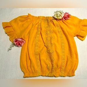 Woman yellow blouse Size M with a beautiful embroidered at the front.